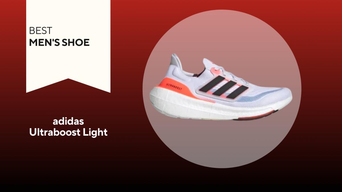 White adidas ultraboost light with black stripes and orange accents